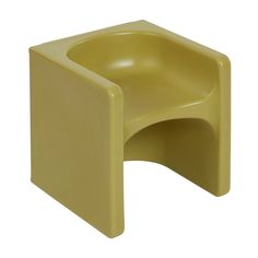 a yellow plastic stool that is shaped like a chair