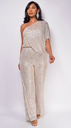 Jumpsuit Sequin bodice One shoulder Elastic waist 95% Polyester 5% Spandex Model's height: 5'8" Model is wearing size S Plus Size Gold Sequin Jumpsuit, Sequin Jumpsuit Outfit Parties, Gold Sequin Jumpsuit Outfit, Gold Pants Suit For Women, White Sequin Dress Outfit, Gold Jumpsuit Outfit, Sequin Jumpsuit Outfit, Gold Sequin Outfit, White Sequin Jumpsuit