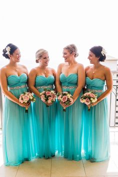 the bridesmaids are all wearing blue dresses