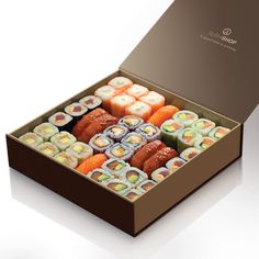 a box filled with assorted sushi rolls on top of a black countertop