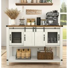 a coffee bar with white cabinets and wooden shelves