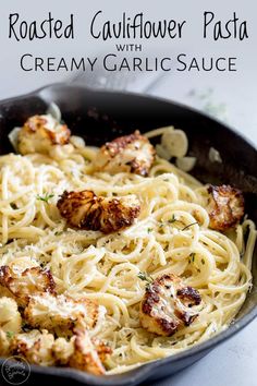 roasted cauliflower pasta with creamy garlic sauce in a cast iron skillet