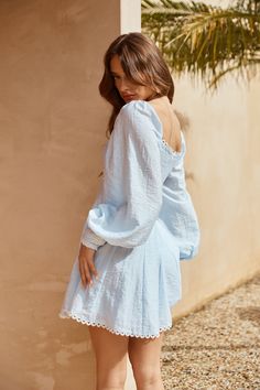 Length from shoulder to hem of size S: 77cm. Chest: 39cm, Waist: 35cm, across front only of size S. Mini dress. Lined, unlined sleeves. Model is a standard XS and is wearing size XS. True to size. Long sleeves. Elastic shoulder. Button cuffs. White embroidered trim. Flowy skirt. Zipper, hook eye closure. Cold hand wash only. Rayon/Nylon. We're in love with this dreamy day dress. The Secret Club Long Sleeve Mini Dress features long sleeves with a slight puff design, button cuffs to the sleeves an Fancy Brunch, Puff Design, Mini Dress Blue, Marine Uniform, Prom Shopping, Skirt Zipper, Embroidered Trim, Mini Dress Shop, Flowy Skirt