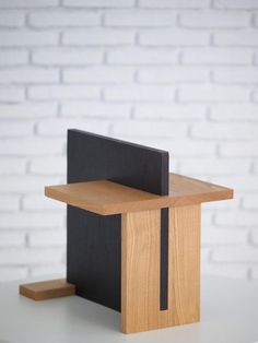 a wooden podium with a black cover on it and a brick wall in the background