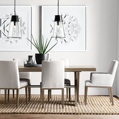 a dining room table with four chairs around it