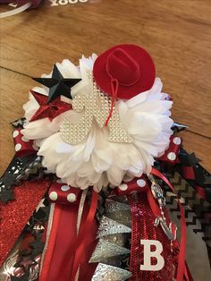 a red, white and black hat with stars on it sitting on top of a table