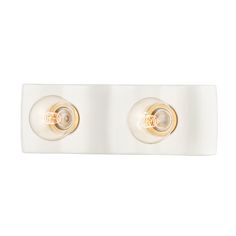 two lights that are on the side of a wall mounted light fixture in white and gold