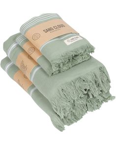 three green towels stacked on top of each other with the label sambuli in front of them