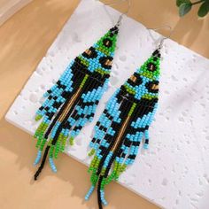 Bohemian Beaded Earrings New Unique & Colorful Ships Within 1 Business Day. All Sales Are Final. Tags - Earrings Bohemian Boho Beaded Costal Cowgirl Spring Beach Vacation Vibes Black Beaded Earrings For Summer, Summer Black Beaded Earrings, Blue Beaded Fringe Earrings For Festival, Blue Bohemian Beaded Earrings For Pierced Ears, Bohemian Blue Beaded Fringe Earrings, Blue Bohemian Beaded Fringe Earrings, Blue Beaded Drop Earrings For Festival, Blue Bohemian Beaded Dangle Earrings, Blue Beaded Earrings With Dangling Beads For Festival