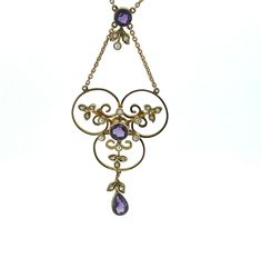 A gorgeous, unique 9ct Gold Art Nouveau Seed Pearl and Amethyst vintage necklace. The necklace weighs 5.63g. The necklace has a length of 10.5 inches altogether, the pendent has a length of 2.5 inches and a width of 1.2 inches. Antique Round Purple Necklace, Victorian Purple Necklace For Anniversary, Vintage Purple Pendant Necklace, Vintage Amethyst Necklace In Yellow Gold, Vintage Amethyst Yellow Gold Necklace, Vintage Amethyst Pendant Necklace, Vintage Round Purple Necklace, Antique Purple Necklace For Wedding, Vintage Purple Round Necklace