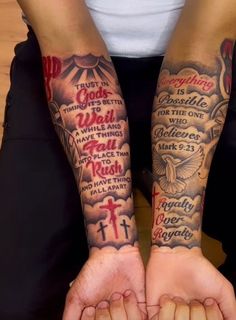 two people with tattoos on their arms, one is holding the other's hands