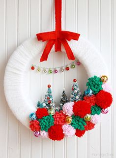 a christmas wreath hanging on the front door