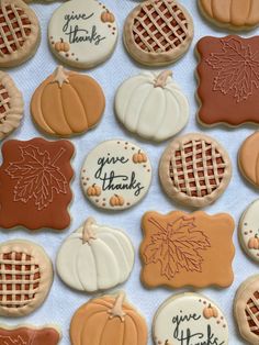 decorated cookies with thank you thanks written on them and pumpkins in the back ground