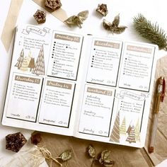 an open planner with christmas decorations on it