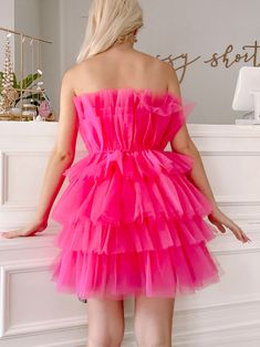 The Too Good To Be Tulle Organza Dress from Sassy Shortcake is a hot pink strapless tiered ruffle dress. She is lined, has a hidden side zipper, and the soft tulle is super comfy - no itch! Also available in baby blue. fits true to size, model wearing a size small Pink Strapless Party Dress With Ruffles, Pink Strapless Dress With Ruffles For Party, Pink Tiered Strapless Dress For Party, Pink Strapless Ruffled Dress, Pink Strapless Ruffled Mini Dress, Pink Strapless Dress With Ruffles, Pink Strapless Tulle Dress For Party, Pink Strapless Dress With Tulle Skirt For Party, Pink Tiered Strapless Dress With Ruffles