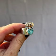 The Levitate ring features a dreamy duo of Dendritic Agate and Carico Lake Turquoise. They sit off center a smooth and comfortable, slightly tapered wide band. The back of the agate stone is cut out to let the light shine through and emulate a -floating on your finger- feeling. It was handcrafted in my home studio using entirely solid sterling silver and finished with a satin finish. Fits a size 9 - 9.25. It is ready to ship and will ship promptly in a branded jewelry box and cotton pouch for gi Mini Waterfall, Turquoise Hoops, Cotton Pouch, Dendritic Agate, Jasper Pendant, Wide Bands, Agate Stone, Signet Ring, Rings Statement