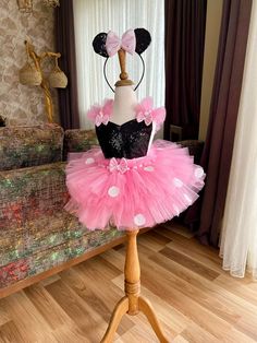 ✨ Introducing the Enchanting Pink Tutu Dress for Toddlers & Babies! ✨ Calling all loving mothers who want the best for their precious ones! Step into a world of magic with our stunning tutu dress. Perfect for birthdays, Halloween, festivals, trips, and everyday dress-up, this dress promises unforgettable moments and turns heads wherever your child goes. Our Dress combines cotton and sequin fabric for a stunning appearance that's both playful and comfortable. With an elastic waist and adjustable straps, it ensures a snug and flexible fit for your little one as she grows. 🎀 Handmade Magic: Every detail is carefully crafted with love. From the delicate ears (optional, available at extra cost) to the charming bows and playful polka dots, our dress sparks imagination and brings the joy of to l Pink Dress For Halloween Dress-up, Cute Pink Tutu Dress For Costume Party, Cute Pink Princess Dress Costume, Pink Fitted Tutu Dress For Costume Party, Black Sleeveless Dress For Birthday, Sleeveless Black Dress For Birthday, Pink Fitted Princess Dress For Halloween, Pink Dresses For Halloween Dress-up, Playful Minnie Mouse Party Dress