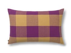 a purple and yellow checkered pillow on a white background