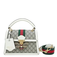 Material: Ebony GG Supreme Canvas with White Leather Trim and Green/Red Web and Pearl Bee Motif Hardware: Gold Features: Pockets: Interior Zipper Pocket, Interior Flat Pocket, 3 Interior Open Compartment Pockets Bag style: Shoulder Bag / Top Handle Closure type: Flap with Press Lock Closure Serial Number / Stamp / Date Code: 476541/493075 Measurement in inches: W x D x H Inclusions: Nothing Condition: in very good condition – 7 out of 10 Exterior: good condition, with few scratches on the hardwa Designer White Satchel As Gift, Designer Satchel With Detachable Strap As Gift, Luxury Square Bags As Fashion Accessory, Luxury Square Bags, White Bags With Gold-tone Hardware As A Gift, White Bags With Gold-tone Hardware For Gifts, Designer Top Handle Satchel, Designer Top Handle Satchel For Fashion, Designer Square Bags For Fashion Accessory