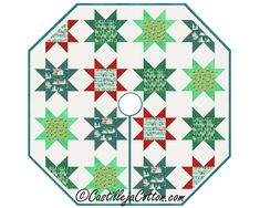 a green, red and white quilted table topper