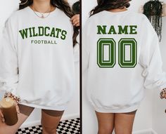 Custom Football Team Name and Number Sweatshirt, Gift For Football Team Lover,Football Mama Hoodie,Game Day Women Hoodie,Football Mom Hoodie Material Details Gildan and Circle Brand Unisex Long Sleeve Hoodies/ C.Neck Sweatshirt No Drawcord in Youth Hoodies For Added Safety Cotton and Polyester Blend Sizing Size charts are provided in the photos, please refer to the charts before placing your order. HOW TO ORDER: 1️- Select the shirt size and color. 2️- Please Enter Design Color on to the Persona White Team Spirit Hoodie For Game Day, White Team Hoodie For Sports Events, White School Spirit Sweatshirt With Team Logo, Football Season Sweatshirt In Team Colors With Team Name, White Varsity Hoodie With Team Name, Varsity Style Football Season Sweatshirt, Varsity White Sweatshirt For Football Season, White Hoodie With Ribbed Cuffs For Game Day, White Hoodie With Team Name For Sports Events