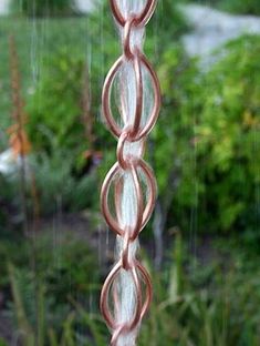 a wind chime hanging from the side of a window