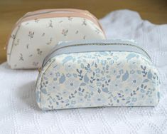 Floral Makeup Bag, Large Cosmetic Pouch, Gift for Women, Blue Blush Toiletry Bag Pouch Travel Bag, Aesthetic Skincare, Handmade Keep your essentials organized in style with this Floral Makeup Bag. Handmade with care, this large cosmetic pouch with gold zipper is perfect for travel or everyday use, featuring a beautiful blue blush floral design. It's the ideal gift for women who love aesthetic skincare and practical, chic accessories. - Details - - This listing is for 1 cotton floral quilted make Portable Light Blue Pouch Bag, Feminine Cosmetic Bag With Removable Pouch For Everyday Use, Light Blue Pouch Bag For Gift, Light Blue Pouch Bag As Gift, Feminine Cosmetic Pouch For Daily Use, Light Blue Bags With Zipper Pouch For Everyday Use, Feminine Zipper Pouch Cosmetic Bag For Daily Use, Blue Clutch Cosmetic Bag For Daily Use, Feminine Bags With Zipper Pouch For Daily Use