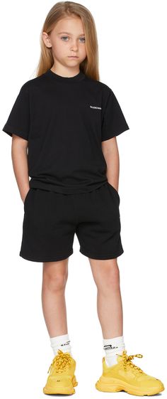 Cotton fleece shorts in black featuring logo printed in white at front . · Mid-rise · Two-pocket styling · Elasticized waistband · Machine wash Model measures 48 / 122 cm tall and wears size 6. Supplier color: Black Size: child's height 2: 35.75 / 91 cm 4: 41.25 / 105 cm 6: 46.75 / 118.5 cm 8: 52.25 / 132.5 cm 10: 55.35 / 140.5 cm Jogging Shorts, Fleece Shorts, Kids Black, Cute Family, Knit Crewneck, Cotton Fleece, Black Logo, Sport Wear, Home Products