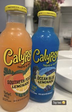 two bottles of calyps are sitting on the counter top next to each other