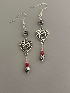 Handmade dangle earrings featuring a silver heart, silver beads, and Crystals.  Drop length 2". Handmade Dangle Earrings, Earrings Handmade Dangle, Gothic Accessories, Heart Dangle Earrings, Lake Forest, Etsy Earrings Dangle, Silver Heart, Silver Beads, Jewelry Earrings Dangle