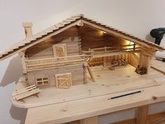 a model of a house made out of wood