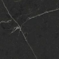 a black marble floor with cracks in it