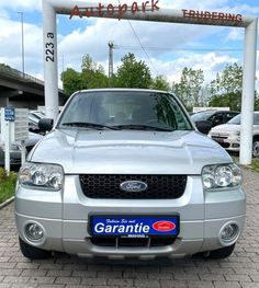 the front end of a silver ford escape