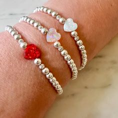 Silver & Opal Heart Beaded Bracelets The Cole Collection Heart Bead Bracelet, Playful Jewelry, Beautiful Beaded Bracelet, Fun Bracelet, Metal Bead, Silver Bead Bracelet, Opal Beads, Initial Bracelet, Silver Bangle Bracelets