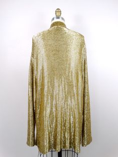 "This is a rare and absolutely gorgeous vintage piece! It's heavily embellished with gold beading and in perfect condition! Measurements are taken with the front brought together. There are no closures. Please note, this piece weighs just over 5 lbs. Bust - 48\" Shoulders - 22\" (hem to hem) Sleeves - 24\" Length - 29\" (top hem to bottom hem) Size - there's no tag size, but fits like an oversized Extra Large All of my items come from a smoke-free and pet-free home. If you have any questions, pl Gold Cardigan For Winter Party, Gold Cardigan For Fall Party, Gold Sequined Long Sleeve Outerwear, Festive Gold Evening Outerwear, Festive Embellished Gold Outerwear, Festive Gold Embellished Outerwear, Embellished Long Sleeve Cardigan For Party, Vintage Gold Long Sleeve Outerwear, Checkered Jacket