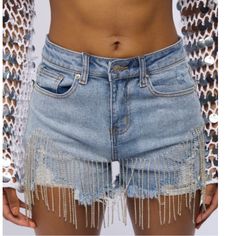 Rhinestone Denim Shorts. Feature A High Rise Waist, A Five-Pocket Design, Functional Belt Loops, Zipper Fly Button Fastening, Slight Distressed Details, Raw Hems, And Glam Rhinestone Fringe Trimming. Waist 13.5” Length 12.5”, Rise 10.25” Alert Label Size Xl But Runs Very Small. It Will Fit Better A Small-Medium, Check Measurements. I’m Posting As A Medium Size. Trendy Denim Blue Bottoms With Rhinestones, Spring Denim Blue Bottoms With Rhinestones, Trendy Denim Jeans With Rhinestone Fringe, Denim Blue Rhinestone Bottoms For Spring, Denim Blue Rhinestones Bottoms For Spring, Spring Denim Blue Rhinestones Bottoms, Short Denim Jeans For Party, Trendy Party Jeans With Pockets, Trendy Embellished Denim Blue Bottoms