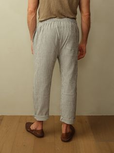 The ultimate vacation pant featuring a drawstring waistband and lightweight double gauze organic cotton. Look your best for long days at the beach, lounging around the hotel, brunch, etc. You get the idea. Fit: Unisex fit. Male model is wearing size M. Female model is wearing size XS. Relaxed fit, tapered leg, drawstring waist. Material: 100% Organic Cotton. Care: Machine wash cold with like color. Tumble dry low. Do not bleach. Cool ironing. Origin: Made in Portugal. Casual Linen Lounging Bottoms, Linen Bottoms With Elastic Waistband For Lounging, Casual Linen Lounging Pants, Summer Relaxed Fit Bottoms For Lounging, Relaxed Fit Pants For Summer Lounging, Comfortable Linen Bottoms For Lounging, Relaxed Fit Pants For Lounging In Summer, Comfortable Linen Lounging Bottoms, Comfortable Lounging Linen Bottoms