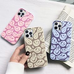 three iphone cases with different designs on them