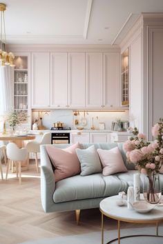 a living room filled with lots of furniture and flowers on top of a coffee table