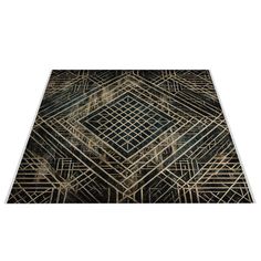 a black and gold rug with an intricate design on the bottom, in front of a white background