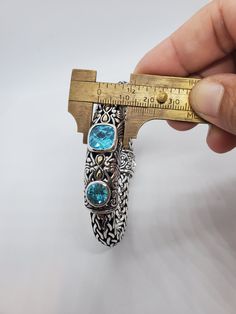 You are viewing a beautiful heavy and thick sterling silver / 18k blue topaz bracelet. The bracelet measures 7 5/8 inches long The bracelet is heavy and very well made with women design. The bracelet is 10mm wide . The total gram weight of the bracelet is 92.69 grams Signed : BJC MARKED : 925 / 18K The workmanship of the bracelet is extraordinary,good condition.. Please make sure to measure your wrist if it fits before buying it. If you have a question please send me a message Samuel B. is a fin Luxury Silver Bracelet With Blue Topaz, Luxury Silver Bracelets With Blue Topaz, Topaz Bracelet, Blue Topaz Bracelet, Women Design, Cabochon Ring, Stunning Necklace, Vintage Bracelets, Chain Link Bracelet