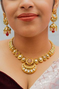 Exotic and snag-free kundan beaded necklace set with earrings. This is a stylish set with White Kundan. This set will work well with traditional, formal, and western formals. Option 1: White Color (D811) Option 2: Red Color (D812) Option 3: Red & Green Color (D813) Eye-catching and unique jewelry that will set you apart. Gift this piece to a loved one, and see their face light up with joy. Best for gifting or for personal use, wear it to any occasion and become the spotlight. Formal Jewelry Sets Chandbali With Meenakari, Formal Jewelry Sets With Meenakari And Chandbali Shape, Formal Meenakari Jewelry Sets For Diwali, Formal Chandbali Kundan Necklace With Meenakari, Formal Chandbali Kundan Necklace For Festivals, Formal Chandbali Jewelry Sets For Diwali, Festive Dual-tone Chandbali Jewelry Sets, Festive Kundan Temple Necklace For Formal Occasions, Formal Kundan Temple Necklace For Festive Occasions