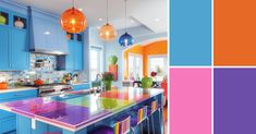 a kitchen with blue cabinets and colorful counter tops