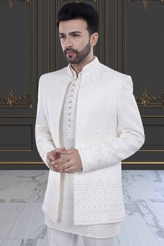 This men's sherwani, featuring elegant sequin and thread work, will elevate any occasion with its open jacket design. The intricate detailing adds a touch of luxury and sophistication. Made with high-quality materials, it is sure to impress with its stunning craftsmanship and modern yet traditional design. Mens Sherwani, Open Jacket, Thread Work, Jacket Design, This Man, Traditional Design, Sequin, Thread, High Quality