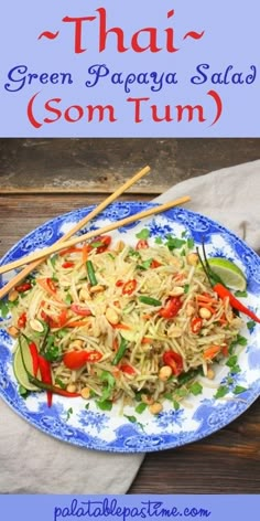 thai green papaya salad on a blue and white plate with chopsticks