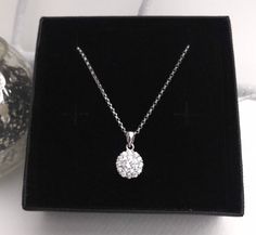 Fabulous crystal pendant with a halo setting. This sparkly pendant is hung from a sterling silver diamond cut chain perfect for a beautiful bride. This necklace has so much sparkle and will dress up any outfit. Everyone loves a little sparkle at this time of year. Your necklace will arrive in a MaddisonDesigns box ready to give as a gift or why not treat yourself. White Diamond Necklace With Halo Setting As Gift, Dazzling Sparkling Diamond Necklace Gift, Silver Diamond Necklace With Halo Setting As Gift, Sparkling Round Pendant Necklace As Gift, Sparkling Round Pendant Necklace For Gifts, Halo Design Solitaire Pendant Necklace Gift, White Necklace With Halo Setting As Gift, White Necklaces With Halo Setting For Gift, Solitaire Pendant Necklace With Halo Design