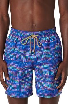 Bright and bold, these printed swim trunks made of lightweight, quick-drying fabric sport a roomy fit and plenty of pockets for essentials. Elastic/drawstring waist Side-seam pockets; back zip pocket with drainage grommets Mesh liner 100% polyester Machine wash, dry flat Imported Blue Nylon Swimming Shorts, Blue Nylon Swim Shorts, Casual Blue Nylon Swimwear, Casual Multicolor Swimwear For Water Sports, Blue Swim Trunks With Pockets For Sports, Blue Sports Swimwear With Pockets, Casual Water Sports Bottoms With Functional Drawstring, Multicolor Sports Shorts With Pockets, Blue Swim Trunks With Side Pockets