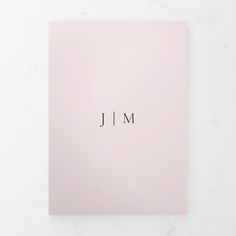 a pink card with the word j m on it