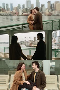 two people are sitting on a bench in front of the water and one person is talking to each other