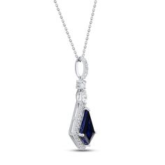 This elegant sterling silver necklace showcases a striking shield-cut blue lab-created sapphire at its center, framed in sparkling white lab-created sapphires. A marquise-cut and round-cut white lab-created sapphire shimmer above, and more round white lab-created sapphires adorn the bail to finish the look. The pendant hangs from an 18-inch cable chain that secures with a lobster clasp. Blue Marquise Cut Jewelry With Diamond Accents, Marquise Sapphire Jewelry For Formal Occasions, Formal Marquise Sapphire Jewelry, Sapphire Cubic Zirconia Jewelry With Marquise Cut, Sapphire Color Cubic Zirconia Marquise Cut Jewelry, Sapphire Colored Marquise Cut Cubic Zirconia Jewelry, Sapphire Color Marquise Cut Cubic Zirconia Jewelry, Blue Marquise Cut Diamond Jewelry, Sapphire Marquise Jewelry With Diamond Accents